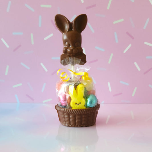 It starts with a Milk chocolate basket. We fill it with fruit flavored jelly beans, a soft marshmallow Peep, chocolate foiled eggs, and finish with a Bowtie Bunny Pop. This basket is a fun treat for Easter!
***Due to its fragile nature this item is only available for in-store pick-up. It can not be shipped***