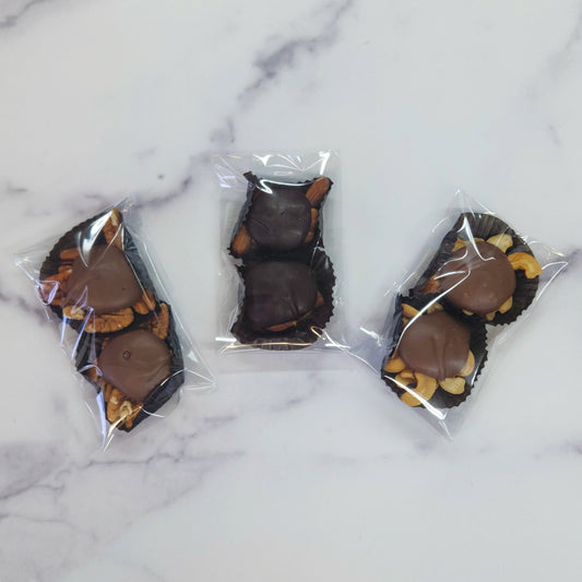 Caramel Nut Clusters in milk or dark chocolate. 2 count packages