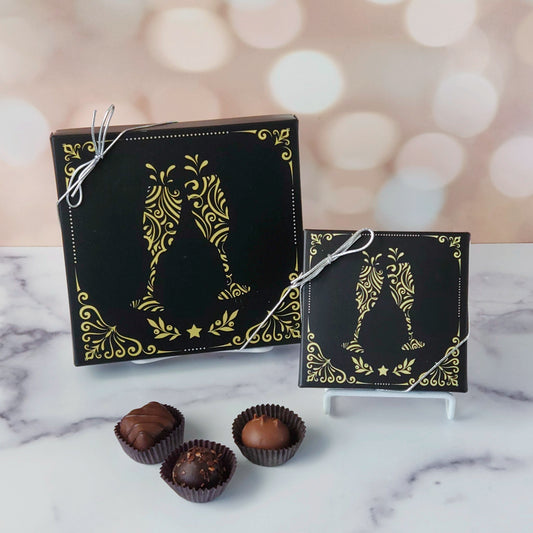 Pop the bubbly and pass the chocolate - our Cheers! Chocolate Box is here to celebrate all of life’s sweet moments. This festive milk and dark chocolate assortment comes in your choice of a 9-piece or 16-piece box, each one topped with a cheerful design featuring clinking champagne glasses. Inside, you’ll discover a joyful mix of smooth creams, buttery caramels, dreamy melt-aways, and rich, decadent truffles. It’s a party in every piece!