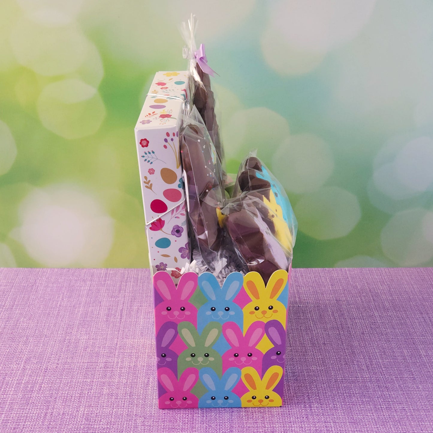 Easter Basket
This basket is filled with everything needed for a perfect holiday celebration, including a 3D Milk Chocolate Bunny, a 2-pack of Easter-decorated, milk chocolate-dipped Oreos, and Chocolate-Dipped Peeps for a fun twist on a classic treat. You'll also enjoy Milk Chocolate Malt Eggs and a 16-piece Milk & Dark Chocolate Popular Assortment with a festive Easter cover