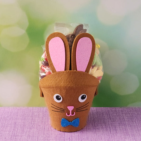 This adorable felt bunny-shaped basket is filled with a delicious assortment of Chocolate-Dipped Marshmallow Peeps, fruity Jelly Beans, Sanded Gummi Bunnies, and a Chocolate Bunny Favor. Wrapped in overwrap and finished with a beautiful bow