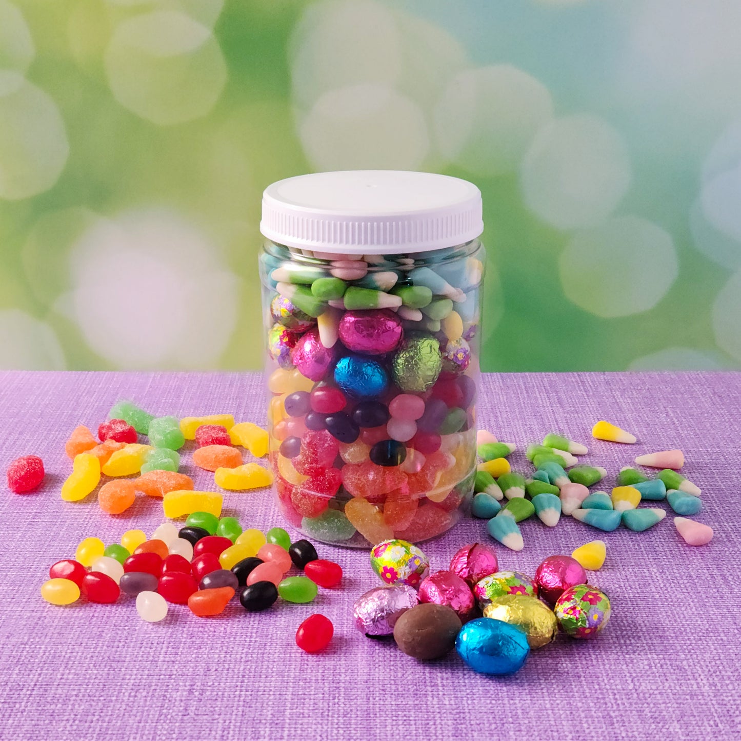 Treat yourself or someone special to our Easter Jarcuterie Jar, a festive and delicious mix of Easter favorites packed into a resealable jar! Filled with over a pound and a half of candy, this jar is bursting with Easter Jelly Mix Gummi, Fruit-Flavored Pectin Jelly Beans, Bunny Corn, and Milk Chocolate Foiled Eggs. Whether you're gifting, sharing, or snacking, this colorful assortment is the perfect way to celebrate the season!