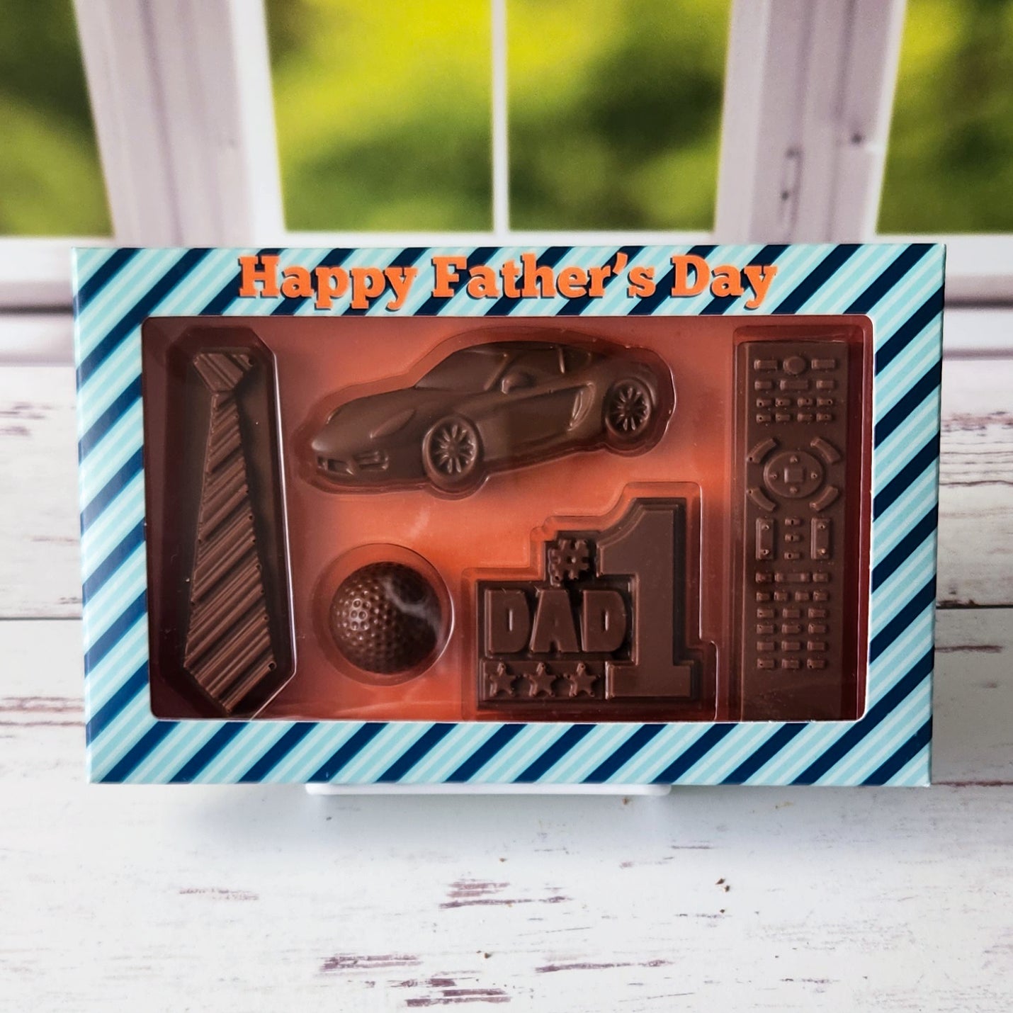 Solid Milk Chocolate in the shape of all of Dad's Favorite things! The perfect gift for Father's Day.