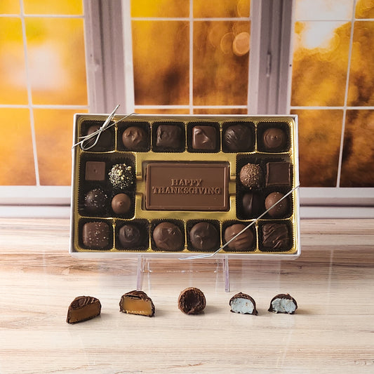 Share the joy of the season with our 20-piece Happy Thanksgiving Candy Box! Inside, a beautifully crafted milk chocolate card that says "Happy Thanksgiving" is surrounded by an irresistible assortment of creamy milk and dark chocolate soft center creams, decadent truffles, and rich caramels. It's the perfect way to spread sweetness and gratitude during your Thanksgiving celebrations!