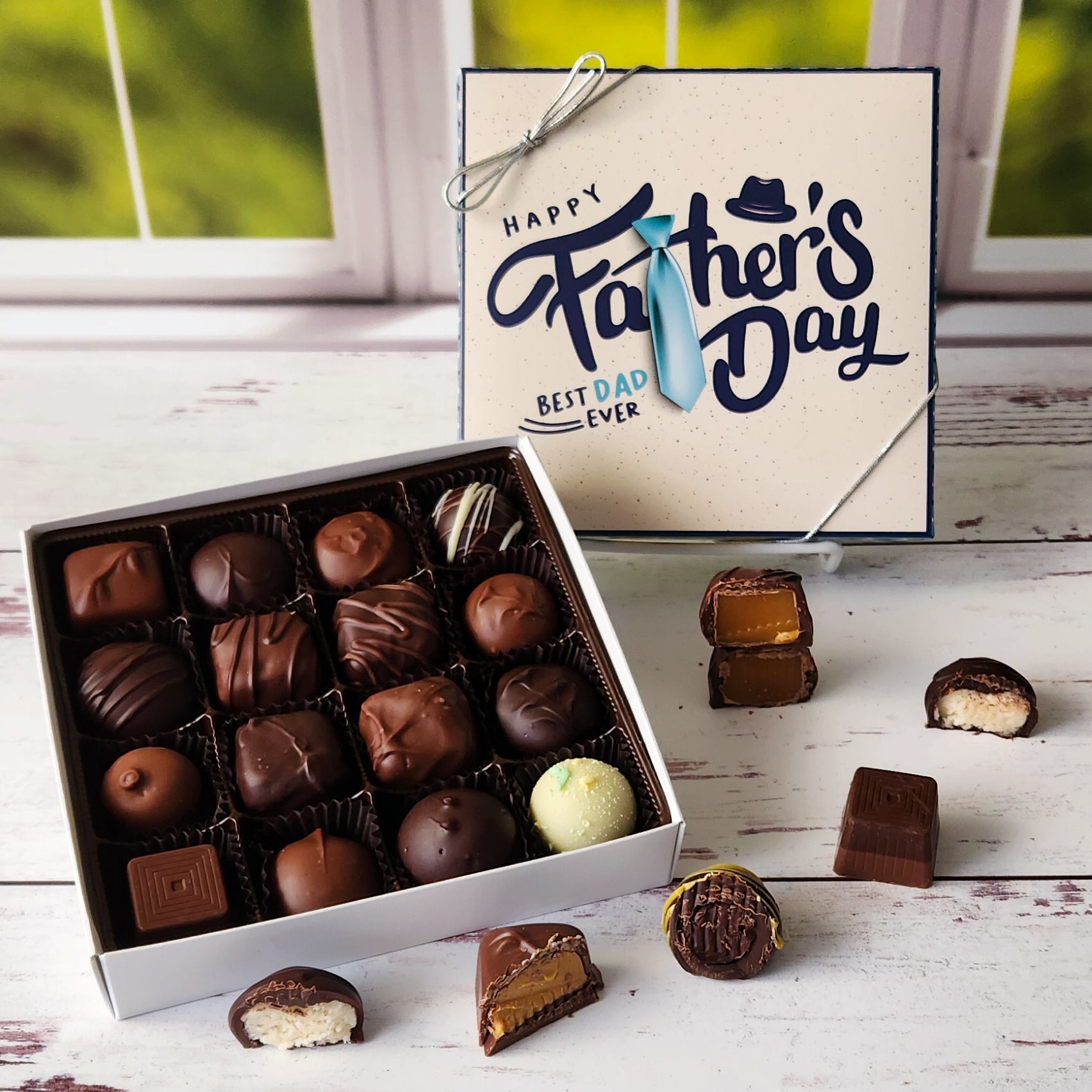 Wish Dad a Happy Father's Day with this delicious chocolate assortment featuring 16 pieces of creams, caramels, truffles and meltaways!