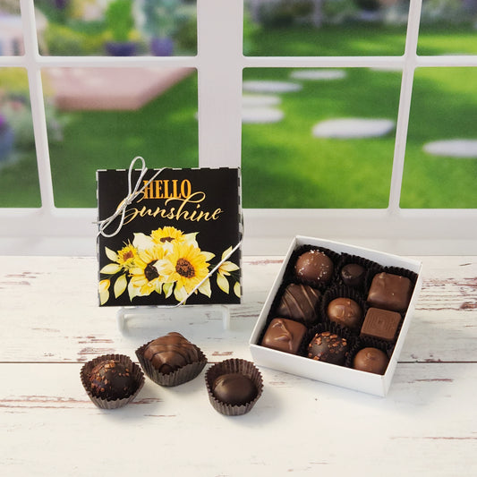 Get ready to brighten someone’s day—or your own—with our Milk & Dark Chocolate Popular Assortment, a delightful mix of chocolatey goodness wrapped in a cheerful Hello Sunshine with Sunflowers box! Enjoy a mix of creams, caramels, melt-aways, and truffles in milk and dark chocolate. Available in 9 or 16 pieces