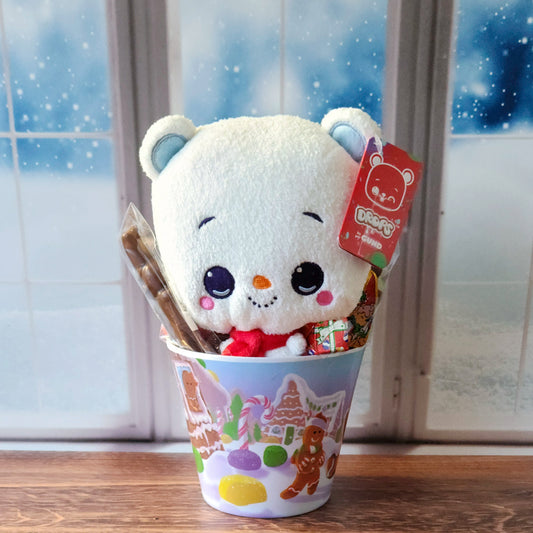 Our Holiday Gift Pail with Stuffed Animal is the perfect choice to spread cheer and joy! Each adorable pail is filled with a delightful assortment of holiday treats, including chocolate-dipped Peeps, a milk chocolate toy soldier, a bag of jolly gingerbread gummies, a milk chocolate foiled present, and a milk chocolate foiled elf. To top it all off, each pail includes a cuddly holiday-themed stuffed animal, making it a gift that’s as sweet as it is fun. Wrapped in a clear bag and tied with a bright bow.