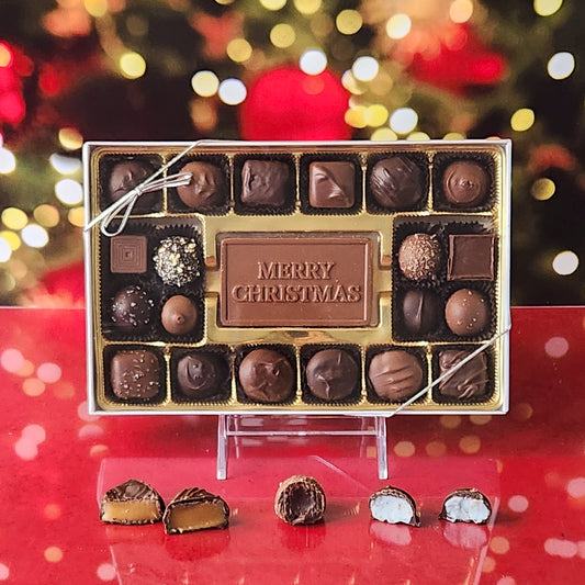 Spread holiday cheer with our 20-piece Merry Christmas Candy Box! Inside, a beautifully crafted milk chocolate card that says "Merry Christmas" is surrounded by a delicious assortment of creamy milk and dark chocolate soft center creams, rich truffles, and delightful caramels. It's the perfect way to celebrate the season and sweeten the holidays for your loved ones!