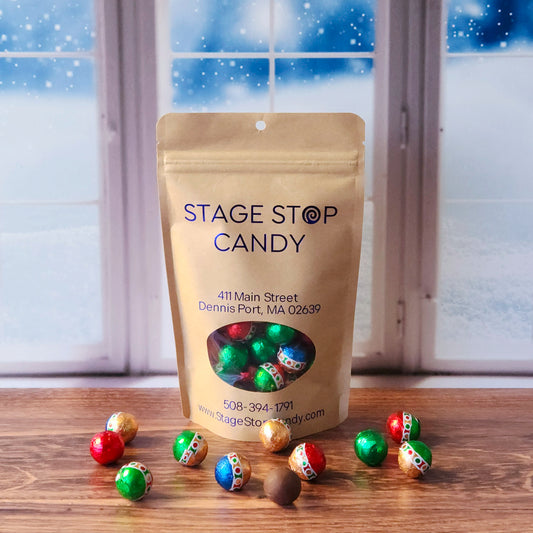 Add sparkle to your holiday season with our Foiled Chocolate Holiday Ornaments! These delightful milk chocolate balls are individually wrapped in vibrant, ornament-style foil, making them perfect for decking out candy dishes, filling stockings, or sharing with loved ones. Packed in a 7-ounce bag