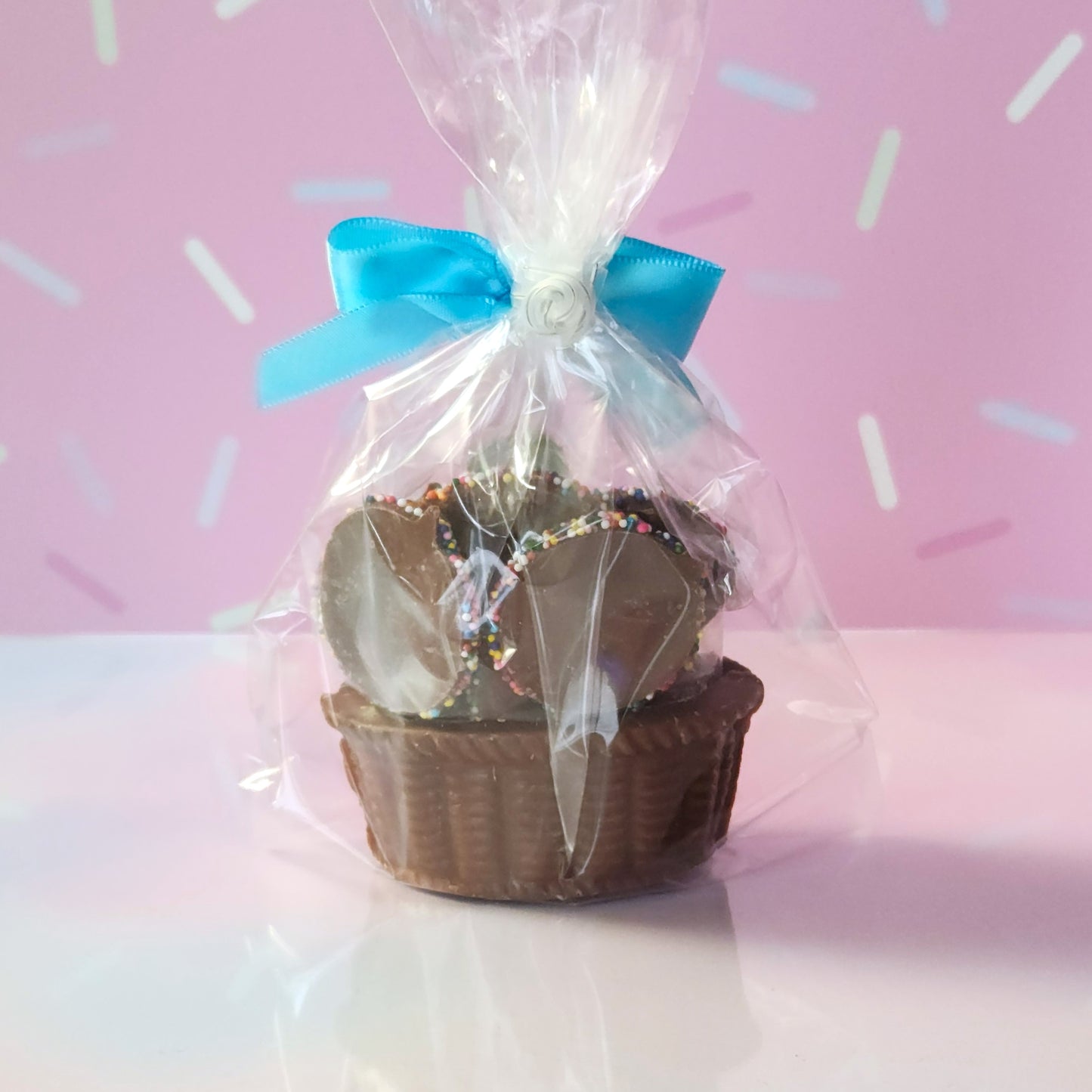 This chocolate basket is filled with our popular nonpareils and a foil chocolate bunny.
