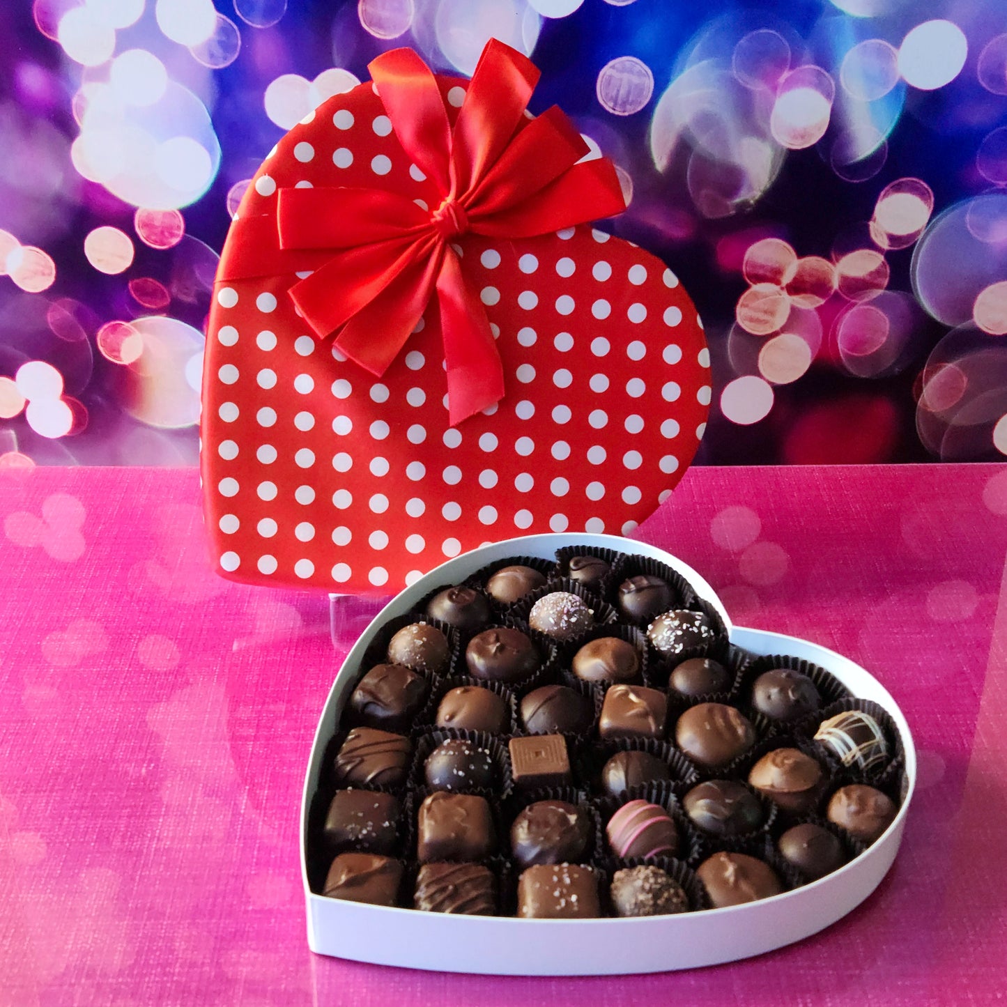 Show your love this Valentine’s Day with our beautiful Heart Boxes, this 34 piece red polka dot heart is filled with a popular assortment of creamy milk and rich dark chocolates with customer-favorite flavors.