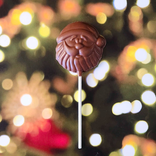 Celebrate the season with our Santa Face Lollipop! This whimsical treat, crafted in the shape of Santa’s jolly face, brings an extra dose of holiday cheer with every bite. Available in smooth Milk Chocolate, it’s a fun and festive way to enjoy a holiday classic.