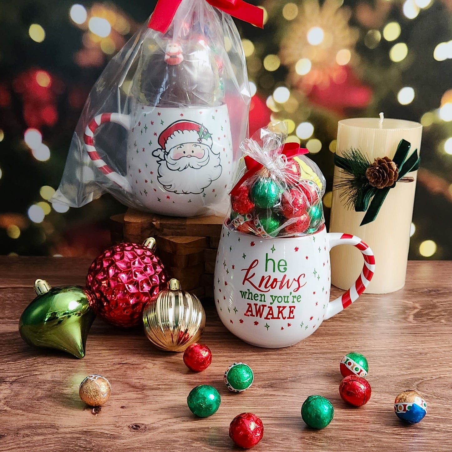 Embrace the holiday spirit with this Santa mug displaying a festive saying and indulge in a Milk Chocolate Hot Cocoa Bomb and Milk Chocolate Foiled Ornaments