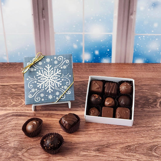 9 Piece Snowflake Chocolate Assortment filled with a variety of creams, caramels, melt-aways and truffles.