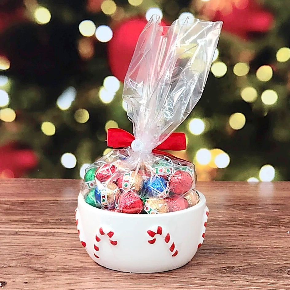 Sweet Tidings Candy Dish, the Candy Cane bowl from the back, red and white candy canes on white with bagged foil chocolates