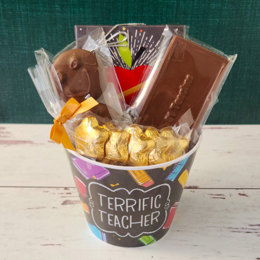 Celebrate your teachers with our Teacher Appreciation Gift Basket.
Inside, they’ll discover a mix of our customer favorites: a 9 piece sampler assortment, Milk Chocolate Gold Foiled Stars, Milk Chocolate Covered Oreos, and a solid Milk Chocolate Bar with #1 Teacher embossed on top—because they truly are.