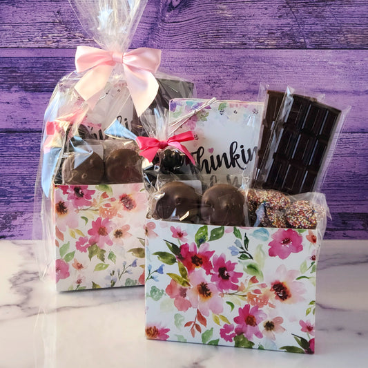 This Thinking of You Gift Basket features:
Dark Chocolate Covered Cranberries, Milk Chocolate Oreos , Milk Chocolate Nonpareils, Milk and Dark Chocolate Candy Bars, A 16-piece Assortment and packaged beautifully making it ready for gifting