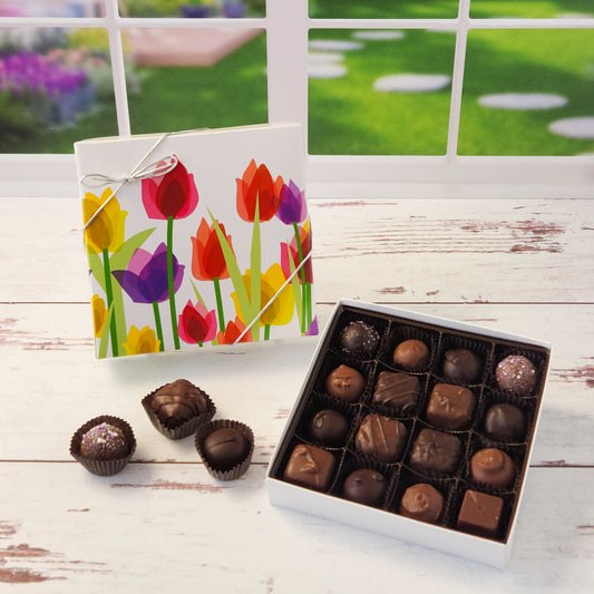 Say it with flowers—and chocolate! Our 16 piece Tulips Chocolate Box is a delightful way to brighten someone’s day with a beautiful blend of sights and tastes. Featuring a cheerful tulip design on the cover, this box is packed with Stage Stop Candy’s popular assortment of milk and dark chocolates. Handcrafted in small batches at our family-run Cape Cod shop, each piece is made with care to deliver that fresh, irresistible flavor we’re known for.