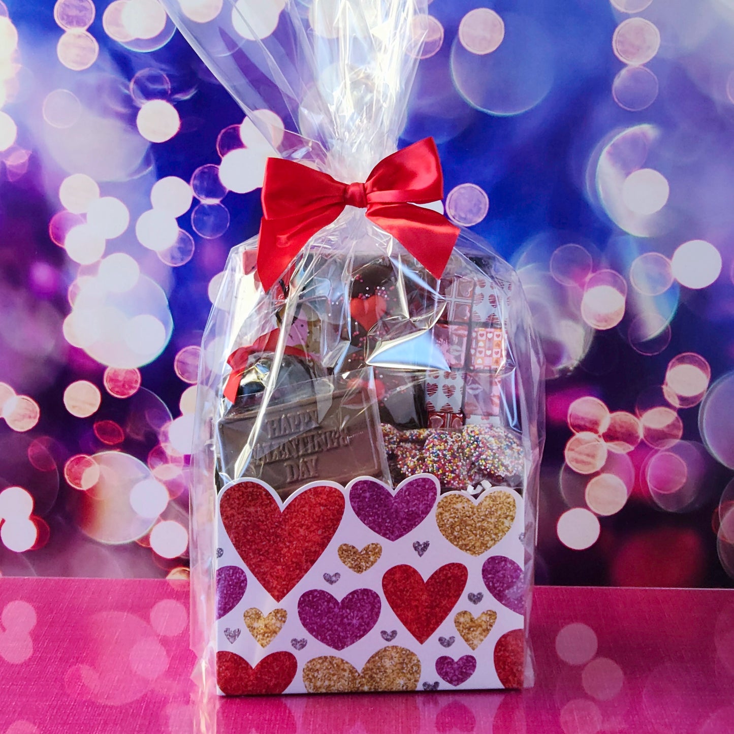 Make this Valentine’s Day unforgettable with our Valentine’s Day Gift Basket featuring:
Dark Chocolate Covered Cranberries, Milk Chocolate Oreos , Milk Chocolate Nonpareils, Milk Chocolate Foil Valentine’s Day Presents,
A 16-piece Assortment and a festive Milk Chocolate Card that says Happy Valentine’s Day to complete the perfect gift