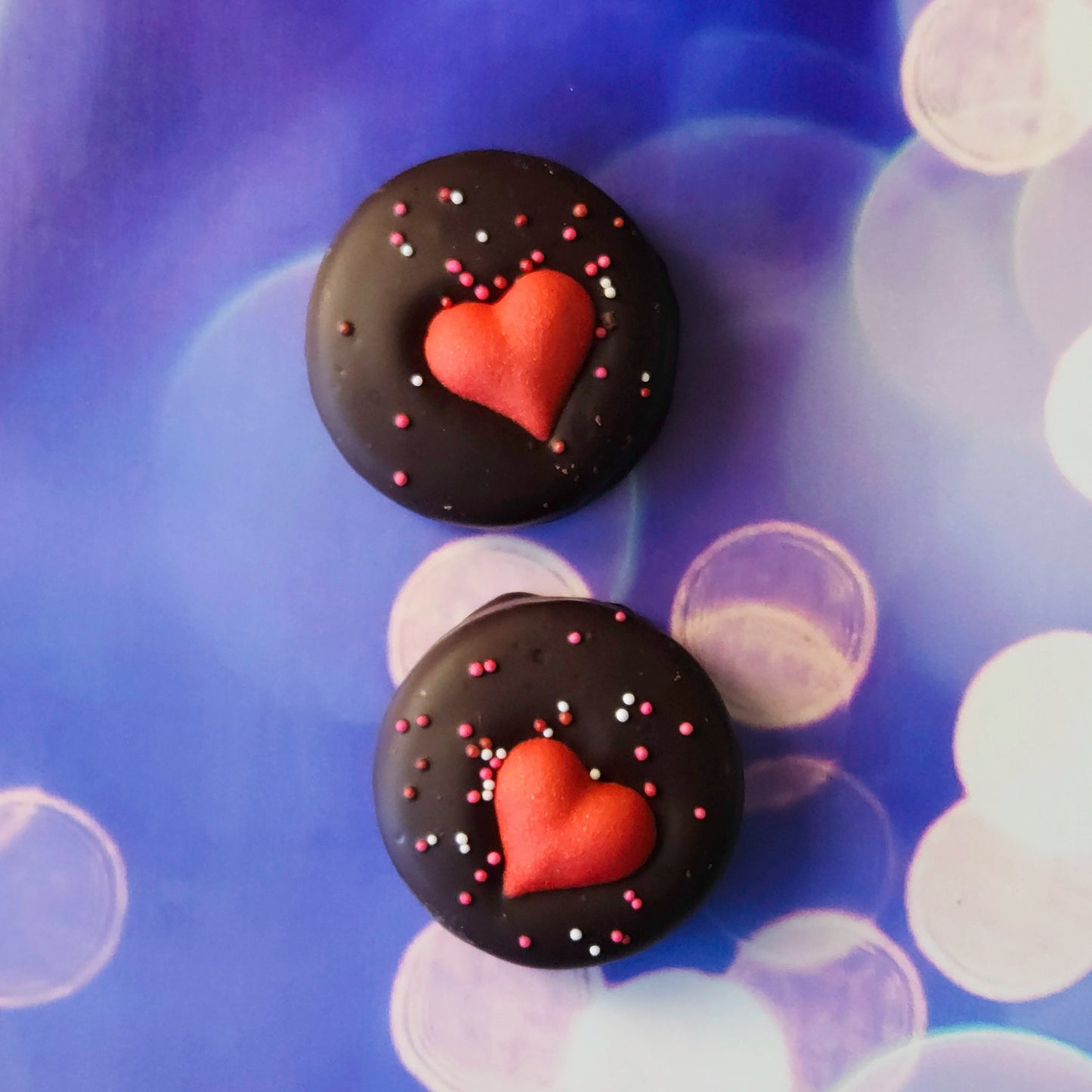 Valentine’s Day Themed Oreos.
Each Oreo is dipped in rich dark chocolate, then topped with festive sprinkles and a sugar heart to spread the Valentine’s Day cheer. Perfectly portioned in a 2-pack, these sweet delights are ready to brighten someone’s day!