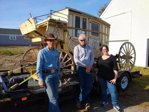 Stage Stop Candy owners with historic stagecoach donated to Abbot-Downing Historical Society