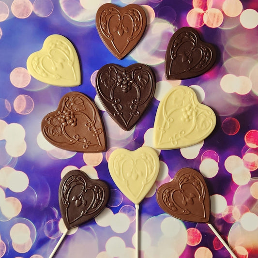 Chocolate Hearts in Milk, Dark and White chocolate against a colorful background