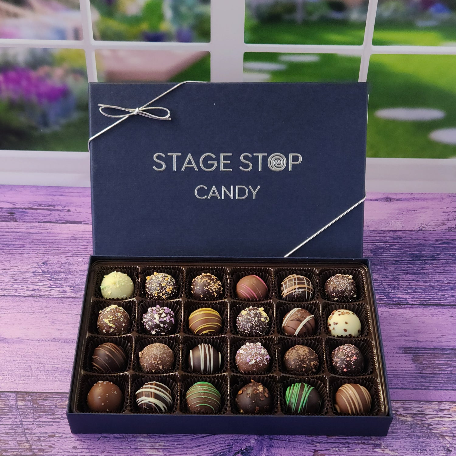 24 piece box of assorted  milk, dark and white chocolate truffles.