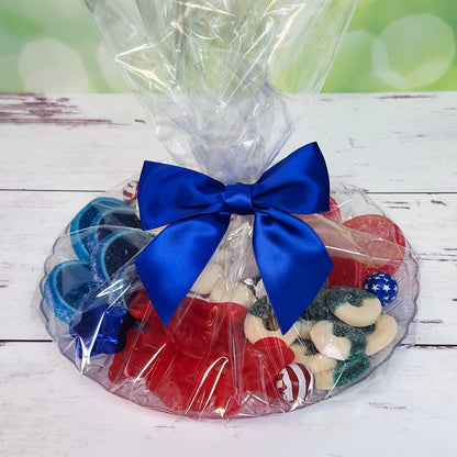 Celebrate summer with our Summer Fun Party Dessert Platter, featuring Milk Chocolate Foiled Stars and Stripes, colorful fruit slices, salt water taffy, gummi lobsters, watermelon rings, and blue raspberry rings. Overwrapped and tied with a cheerful bow, this delightful assortment is perfect for gifting or adding a festive touch to any summer party!