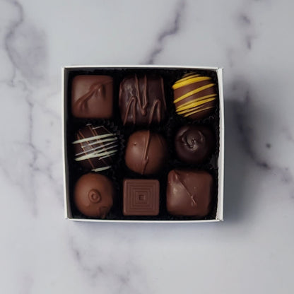 A 9 piece assortment of our most popular milk and dark chocolate creams, caramels, melt-aways and truffles. 