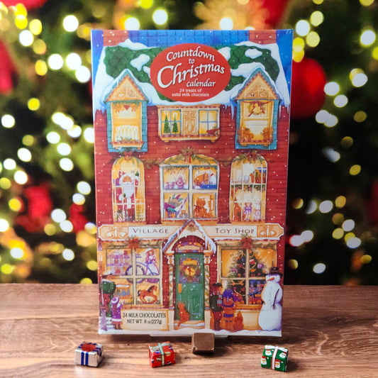 Make the holiday countdown magical with our Village Toy Shop Advent Calendar! Each December day reveals a new solid milk chocolate treat behind the doors and windows of a charming Victorian toy shop scene, with 24 chocolates in total to enjoy. 