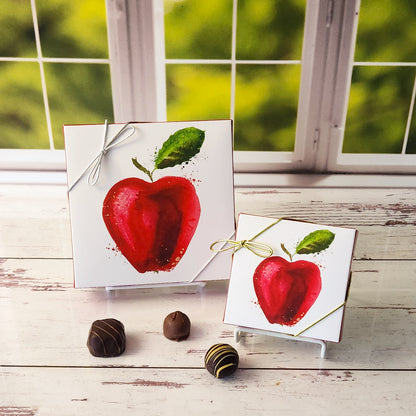 An assortment of our most popular milk and dark chocolate creams, caramels, meltaways and truffles are packed inside an apple themed box.