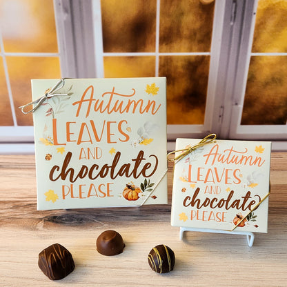 An assortment of our most popular milk and dark chocolate creams, caramels, melt-aways, and truffles all packed inside a box with the festive saying "Autumn Leaves and Chocolate Please" printed on the cover.