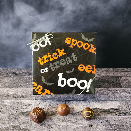 An assortment of our most popular milk and dark chocolate creams, caramels, melt-aways, and truffles all packed inside a box with a Halloween themed print.