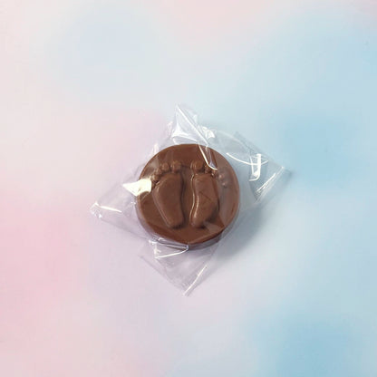 Chocolate mold in clear plastic packaging on a gradient background