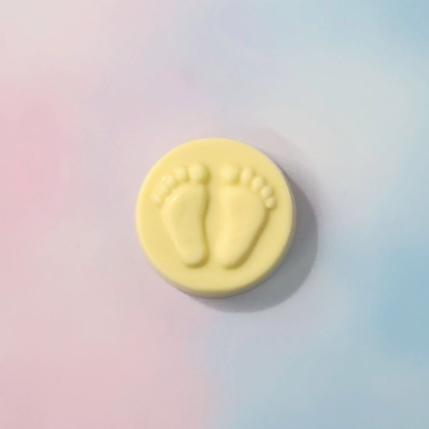 White Chocolate circle with footprints on a gradient background