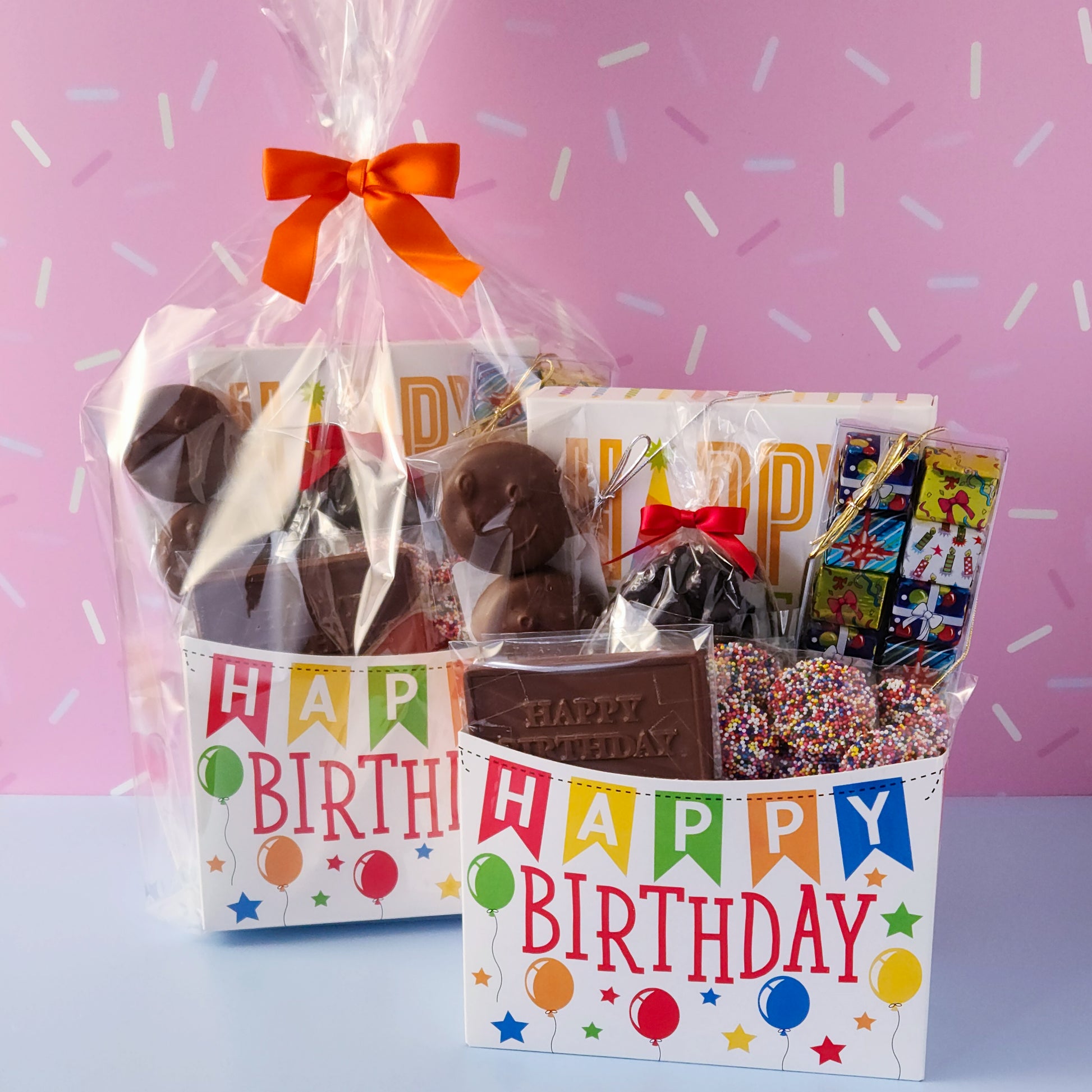 Make birthdays extra special with our Birthday Gift Basket, a delightful assortment of handcrafted chocolates that’s sure to bring a smile to any chocolate lover’s face! Packed with a delicious mix of milk and dark chocolate treats. 
16-Piece Milk and Dark Chocolate Assortment, Milk Chocolate "Happy Birthday" Card, Milk Chocolate Covered Oreos, Milk Chocolate Nonpareils & Foiled Presents, and Dark Chocolate Covered Cranberries all overwrapped and tied with a bow, this basket is ready to gift.