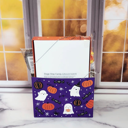 Halloween Boo Gift Basket.
Inside this fun Halloween themed basket you will find Candy Corn, a Milk Chocolate Witch, Halloween Chocolate-Covered Oreos, Chocolate-Covered Peeps, and a 16-Piece Happy Halloween Chocolate Assortment (creams, caramels, melt-aways, truffles)