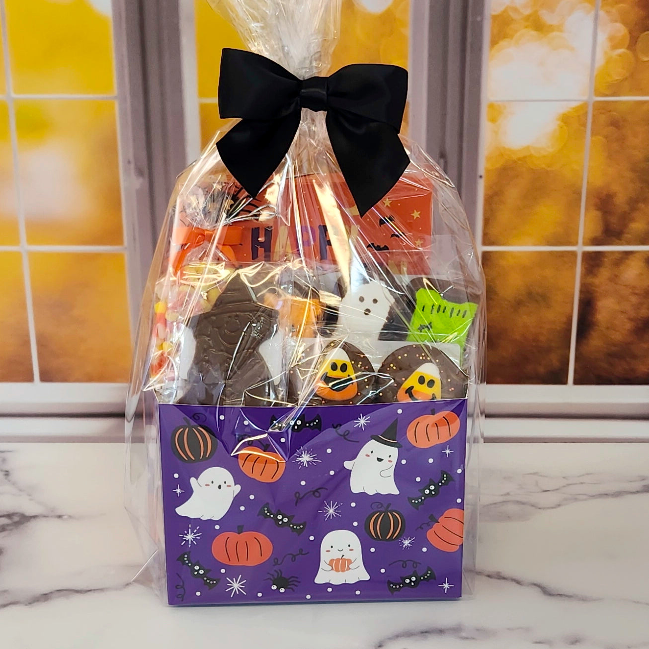Halloween Boo Gift Basket.
Inside this fun Halloween themed basket you will find Candy Corn, a Milk Chocolate Witch, Halloween Chocolate-Covered Oreos, Chocolate-Covered Peeps, and a 16-Piece Happy Halloween Chocolate Assortment (creams, caramels, melt-aways, truffles)