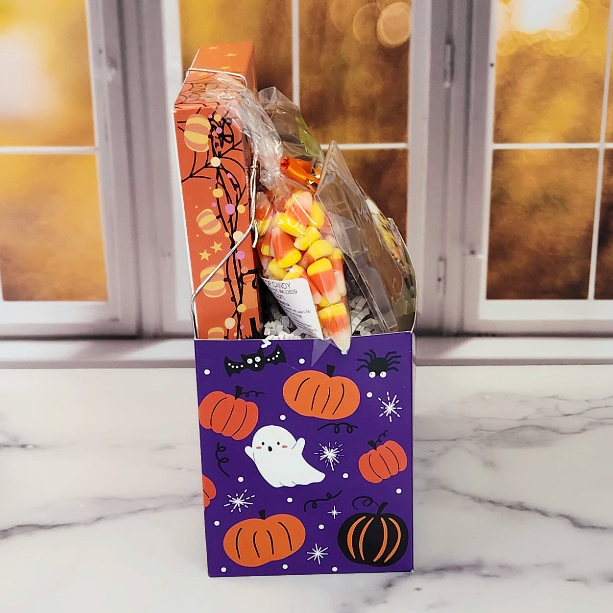 Halloween Boo Gift Basket.
Inside this fun Halloween themed basket you will find Candy Corn, a Milk Chocolate Witch, Halloween Chocolate-Covered Oreos, Chocolate-Covered Peeps, and a 16-Piece Happy Halloween Chocolate Assortment (creams, caramels, melt-aways, truffles)