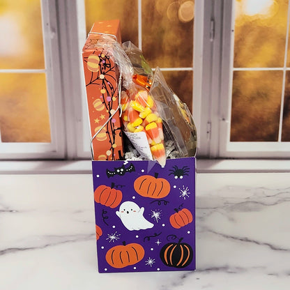 Halloween Boo Gift Basket.
Inside this fun Halloween themed basket you will find Candy Corn, a Milk Chocolate Witch, Halloween Chocolate-Covered Oreos, Chocolate-Covered Peeps, and a 16-Piece Happy Halloween Chocolate Assortment (creams, caramels, melt-aways, truffles)