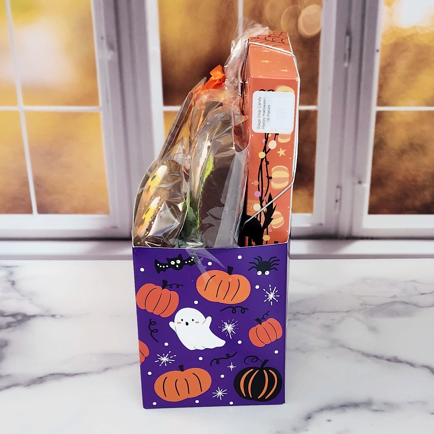 Halloween Boo Gift Basket.
Inside this fun Halloween themed basket you will find Candy Corn, a Milk Chocolate Witch, Halloween Chocolate-Covered Oreos, Chocolate-Covered Peeps, and a 16-Piece Happy Halloween Chocolate Assortment (creams, caramels, melt-aways, truffles)