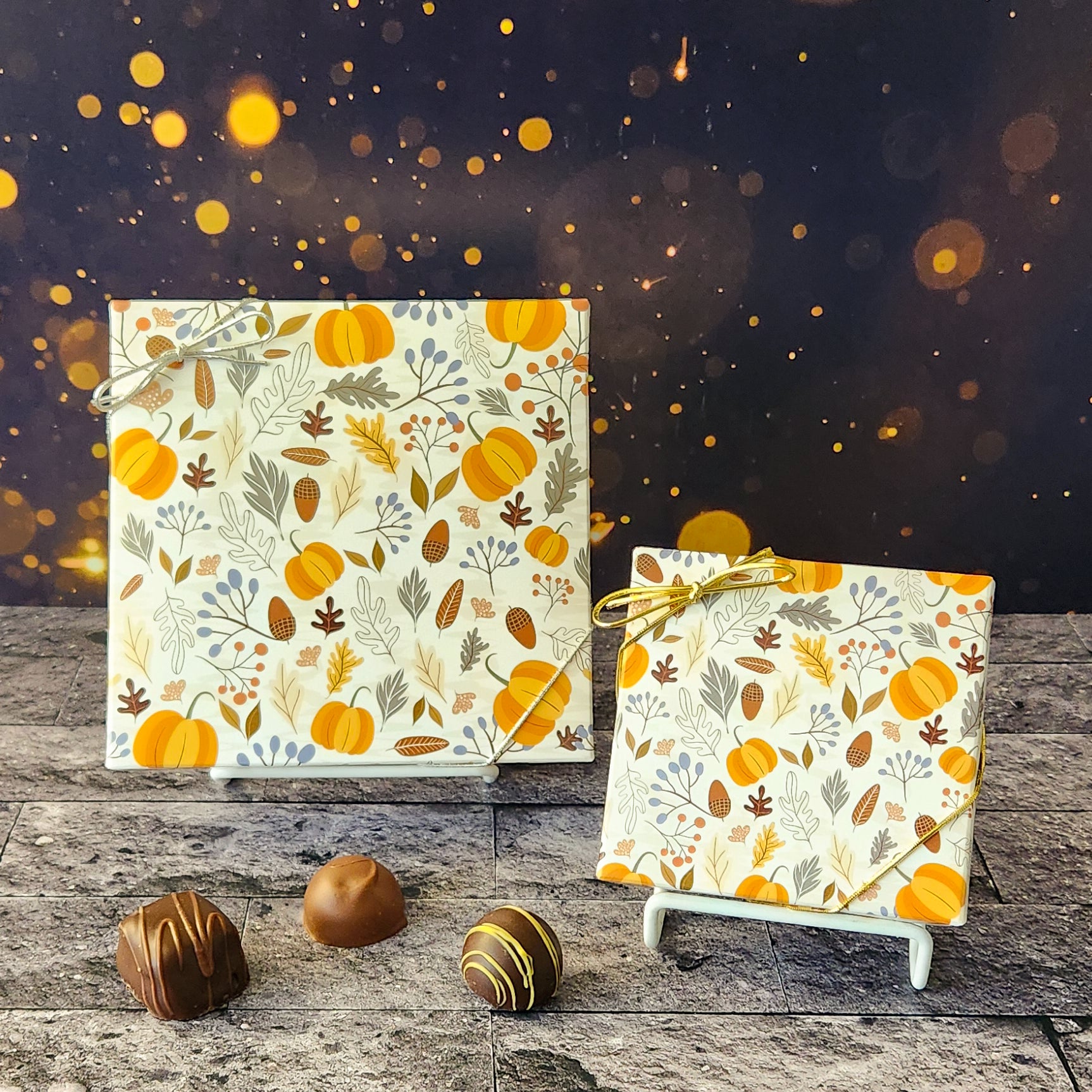 An assortment of our most popular milk and dark chocolate creams, caramels, melt-aways, and truffles all packed inside a box with a festive fall cover featuring leaves, pumpkins and acorns.