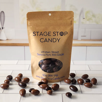 Enjoy the delightful variety of our Chocolate Bridge Mix, featuring chocolate-covered cashews, raisins, and malted milk balls. Each 6-ounce bag offers a delicious blend of flavors and textures perfect for snacking or sharing.