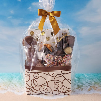 Swirl Cape Cod themed gift basket
Filled with
16-Piece Milk &amp; Dark Chocolate Popular Assortment, Milk Chocolate Lighthouse, Milk Chocolate Covered Oreos, Milk Chocolate Nonpareils, 
Dark Chocolate Covered Cranberries and a chocolate Shell Sampler (10 Pieces).
Overwrapped and tied with a beautiful bow perfect for gifting.