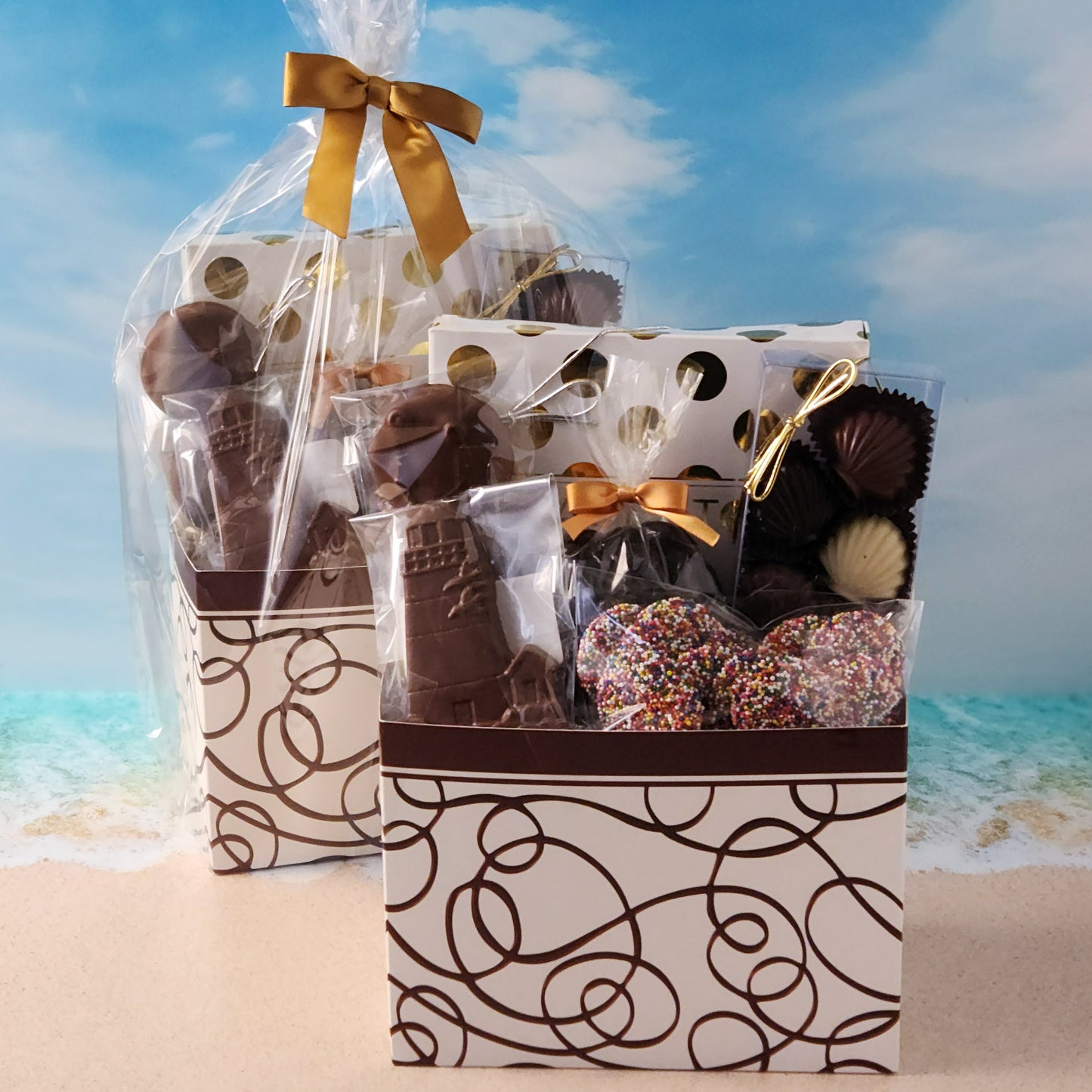 Swirl Cape Cod themed gift basket
Filled with
16-Piece Milk &amp; Dark Chocolate Popular Assortment, Milk Chocolate Lighthouse, Milk Chocolate Covered Oreos, Milk Chocolate Nonpareils, 
Dark Chocolate Covered Cranberries and a chocolate Shell Sampler (10 Pieces).
Overwrapped and tied with a beautiful bow perfect for gifting.