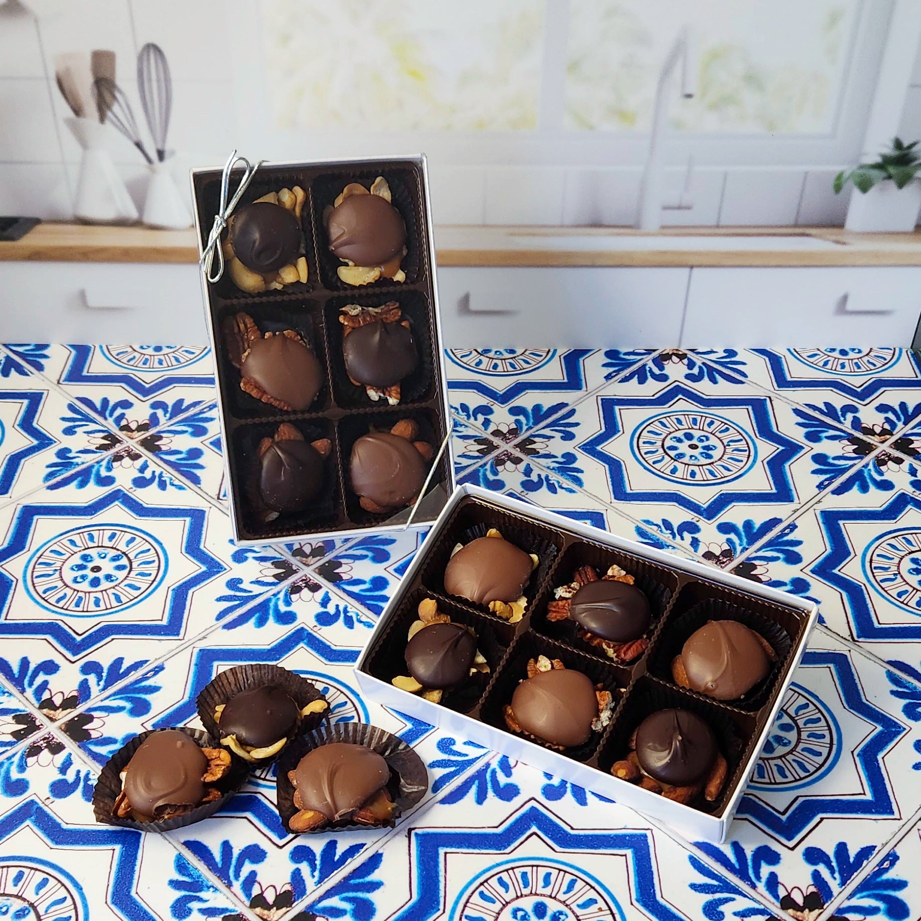 Caramel, nuts, and chocolate come together in a wonderful harmony of flavors. Every piece is made with freshly roasted nuts (almonds, cashews, or pecans), held together with delicious, hand made vanilla caramel and topped with our rich Milk chocolate or Dark chocolate