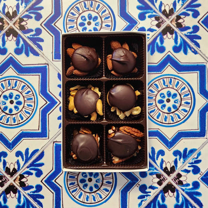 Caramel, nuts, and chocolate come together in a wonderful harmony of flavors. Every piece is made with freshly roasted nuts (almonds, cashews, or pecans), held together with delicious, hand made vanilla caramel and topped with our rich Milk chocolate or Dark chocolate