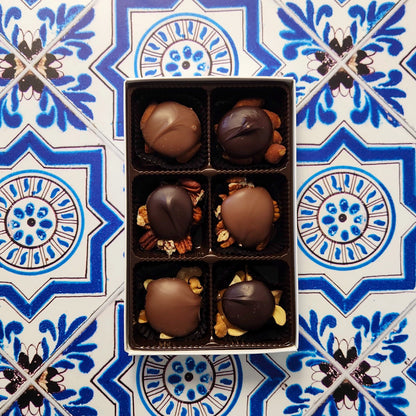 Caramel, nuts, and chocolate come together in a wonderful harmony of flavors. Every piece is made with freshly roasted nuts (almonds, cashews, or pecans), held together with delicious, hand made vanilla caramel and topped with our rich Milk chocolate or Dark chocolate