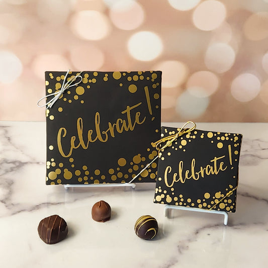 An assortment of our most popular milk and dark chocolate creams, caramels, melt-aways, and truffles all packed inside a festive box. On the cover of the box the word Celebrate is printed with gold dots surrounding it.