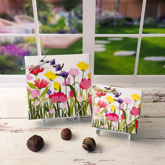 An assortment of our most popular milk and dark chocolate creams, caramels, melt-aways, and truffles all packed inside a Cheerful Garden printed box.